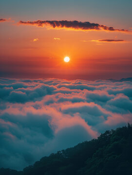 The sky is filled with clouds and the sun is setting