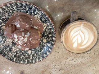 restaurant menu, cafe menu, chocolate profiteroles and latte coffee isolated on wood