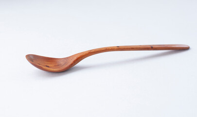 Wooden kitchen utensils stacked view, spoon and spatula