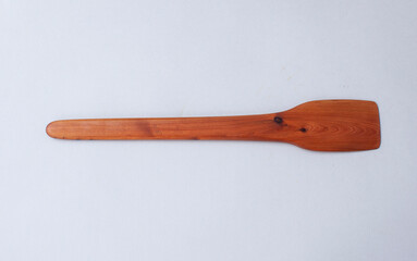 Wooden kitchen utensils stacked view, spoon and spatula