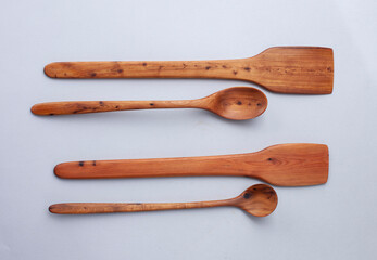Wooden kitchen utensils stacked view, spoon and spatula