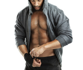 Boxing, fitness and man wrapping hands in studio isolated on white background for fight or self...