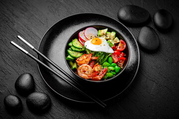 Shrimp Poke bowl composition on black background. The Art of Japanese Cuisine. Food photography for menu and sushi bar decoration