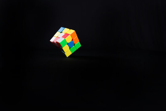 Magic cube or Rubiks cube on white background. Invention by Hungarian architect Erno Rubik in 1974