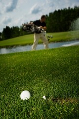 Golf Ball And Golfer In Background