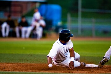 Baseball Player Sliding Onto A Base