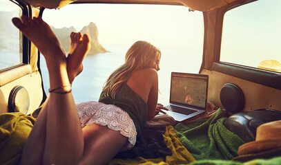 Car, travel and woman with laptop for relax, sunset and remote worker for road trip. Transport,...