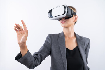 Professional female leader touching at program or working while using VR glasses. Skilled...