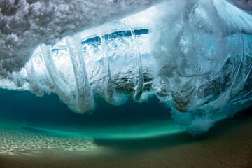 Underwater spiraling vortex captured in crystal clear water