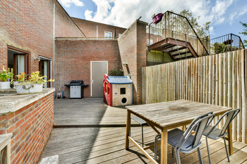 Serene home backyard with brick walls and wooden decking
