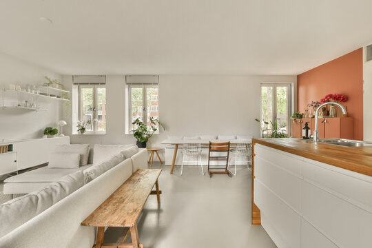 Bright and stylish interior of a modern kitchen-living space