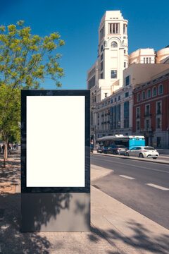 Blank billboard in sunny Madrid streetscape mockup