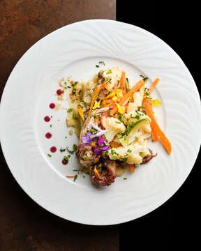 Beautifully plated gourmet dish with exotic garnishes