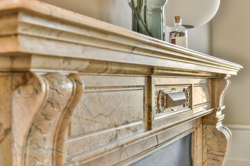 Elegant marble fireplace with decorative details