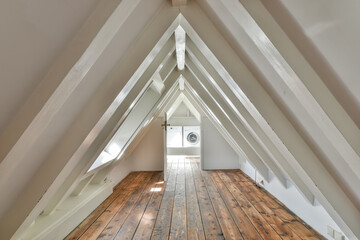 Cozy attic interior with vintage wooden floor and skylight