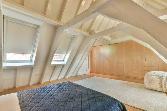 Bright and modern attic bedroom with elegant decor