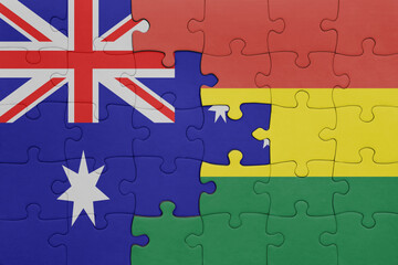 puzzle with the colourful national flag of bolivia and flag of australia.