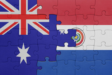 puzzle with the colourful national flag of paraguay and flag of australia.