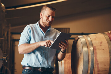 Business, man and happy with tablet in brewery as manager with pride on product, process and...