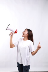 Happy beautiful Asian woman talking on megaphone to sideways while pointing other side. isolated on...