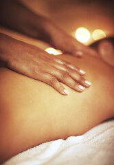 Fototapeta premium Hands, back massage and masseuse with woman at spa for luxury, calm and relaxing pamper routine. Beauty, aromatherapy and therapist with female person for muscle tension relief treatment at resort.