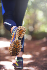 Shoes, running or person hiking on trail in nature on outdoor adventure to explore in terrain...