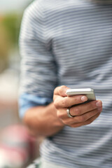 Man, hands and typing with phone for communication, browsing or social media in nature. Closeup of male person on mobile smartphone in online chatting, texting or app for contact, share or research
