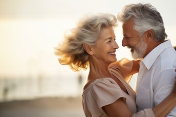 Senior couple dancing and embracing in warm sunset light
