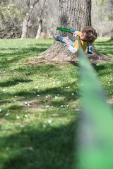 A Child falling while trying to walk on slackline