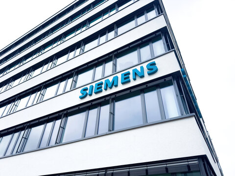Freiburg, Germany - Mar 4, 2024: A large Siemens logotype in the typical traditional Siemens color is prominently displayed on the facade of a building in Germany,