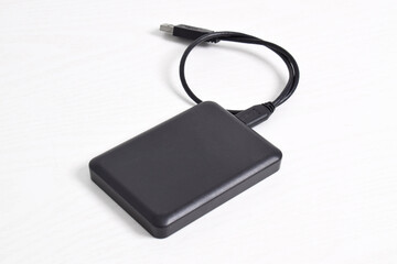External Hard Disk drive with usb cable isolated on white background. External HDD with usb...
