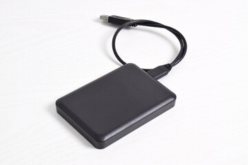 External Hard Disk drive with usb cable isolated on white background. External HDD with usb connector