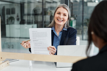 Attorney, smile and documents in office with mature woman for agreement, contract for review. Legal...