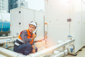 HAVC refrigeration system mechanic daily inspection refrigeration equipment on the roof building...