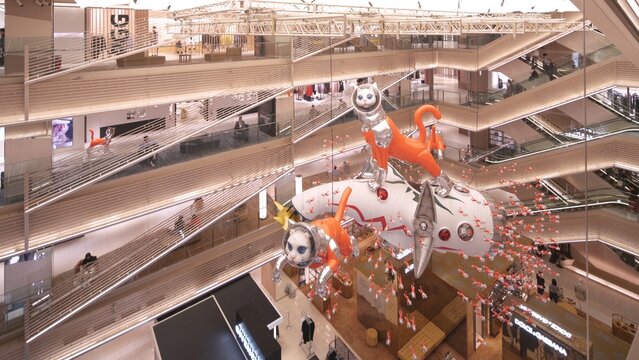tokyo, japan - may 14 2024: Video featuring the Contemporary Art installation BIG CAT BANG by Japanese artist Kenji Yanobe, exhibited in the atrium of Ginza Six Department Store through summer 2025.