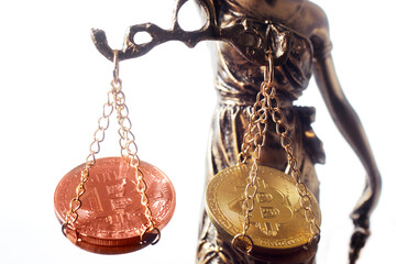 statue Themis representing justice and fairness with bitcoin crypto currencys ,  virtual coin to business exchange