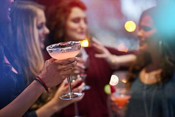 Hand, friends and cocktail with women in nightclub, event and conversation at happy hour. People,...