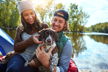 Dog, couple and love in nature for camping in forest, sunshine and bond, smile and support of...