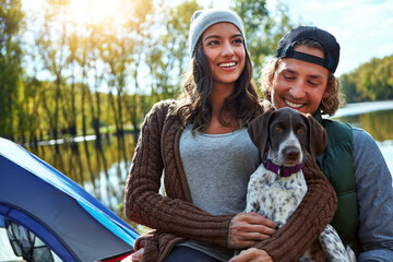 Couple, camping and smile at lake with dog for freedom, adventure travel with sustainability. Man,...