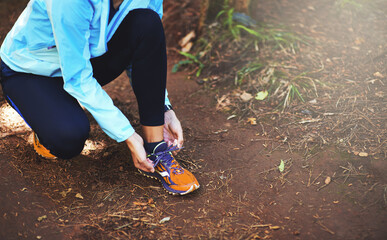 Hands, runner and nature to tie shoelace on ground for training, exercise or fitness to start...