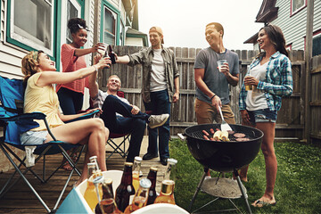 Friends, cheers and beer in backyard with bbq for social event, party or celebration with talking...