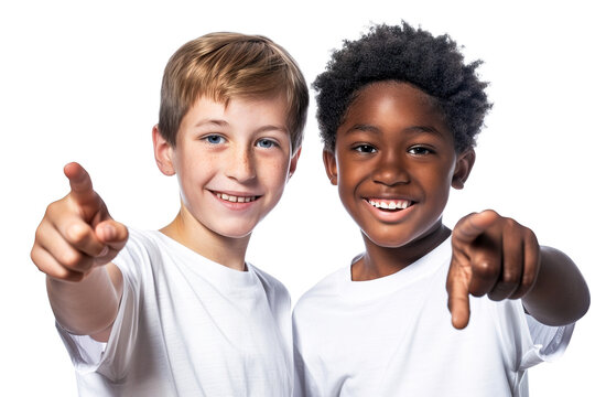 Two cheerful multi ethnic little boys pointing at camera with finger and smiling. Isolated over white transparent background