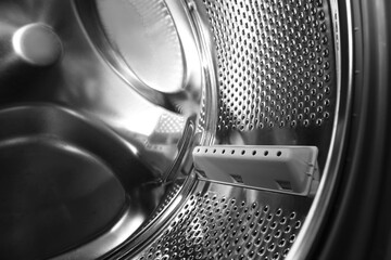 Empty washing machine drum, closeup. Laundry day