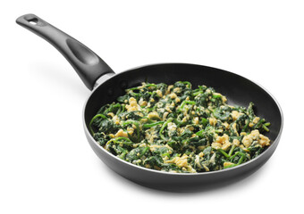 Tasty spinach dip with eggs in frying pan isolated on white