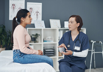 Doctor, woman and patient speaking in office, reproductive health and consultation in checkup for...