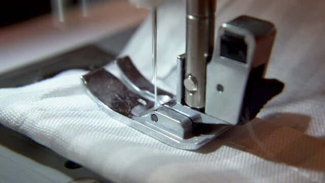 close up of sewing machine making a long needlework