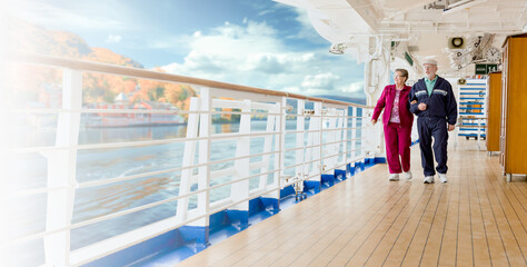 Banner of a Happy Senior Adult Couple Strolling Along the Cruise Ship Deck Exercising On a Crisp...