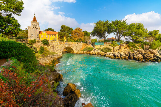 View from a small bay and cove along the rocky coastline of the Palace of Condes de Castro Guimaraes, a seaside museum along the Riviera at Cascais, Portugal.