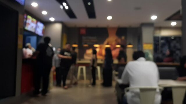 People in modern cafe restaurant, People Ordering from the Fast Food restaurant. Blurred background 4K video