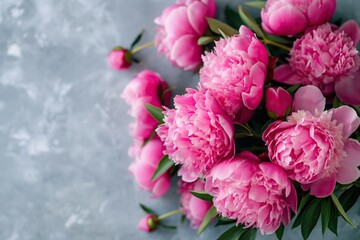 Obraz premium Bouquet of pink peonies on a light background.